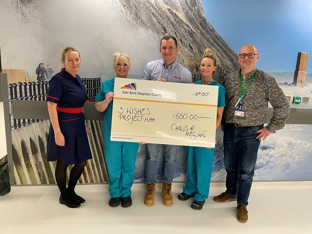 Chris Rowsell presents the cheque to staff from the critical care unit.