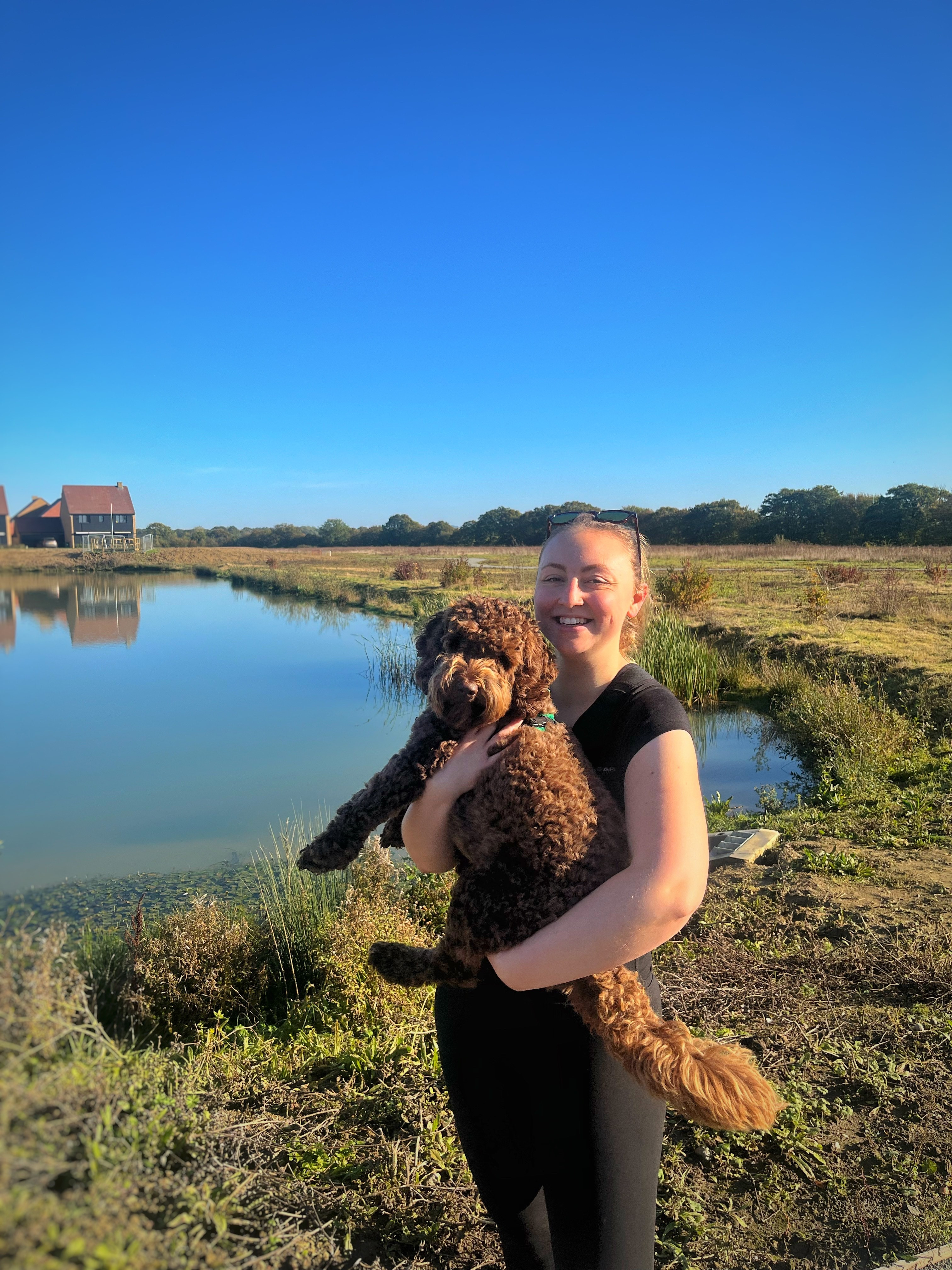 Dana with her dog Herbie by a river