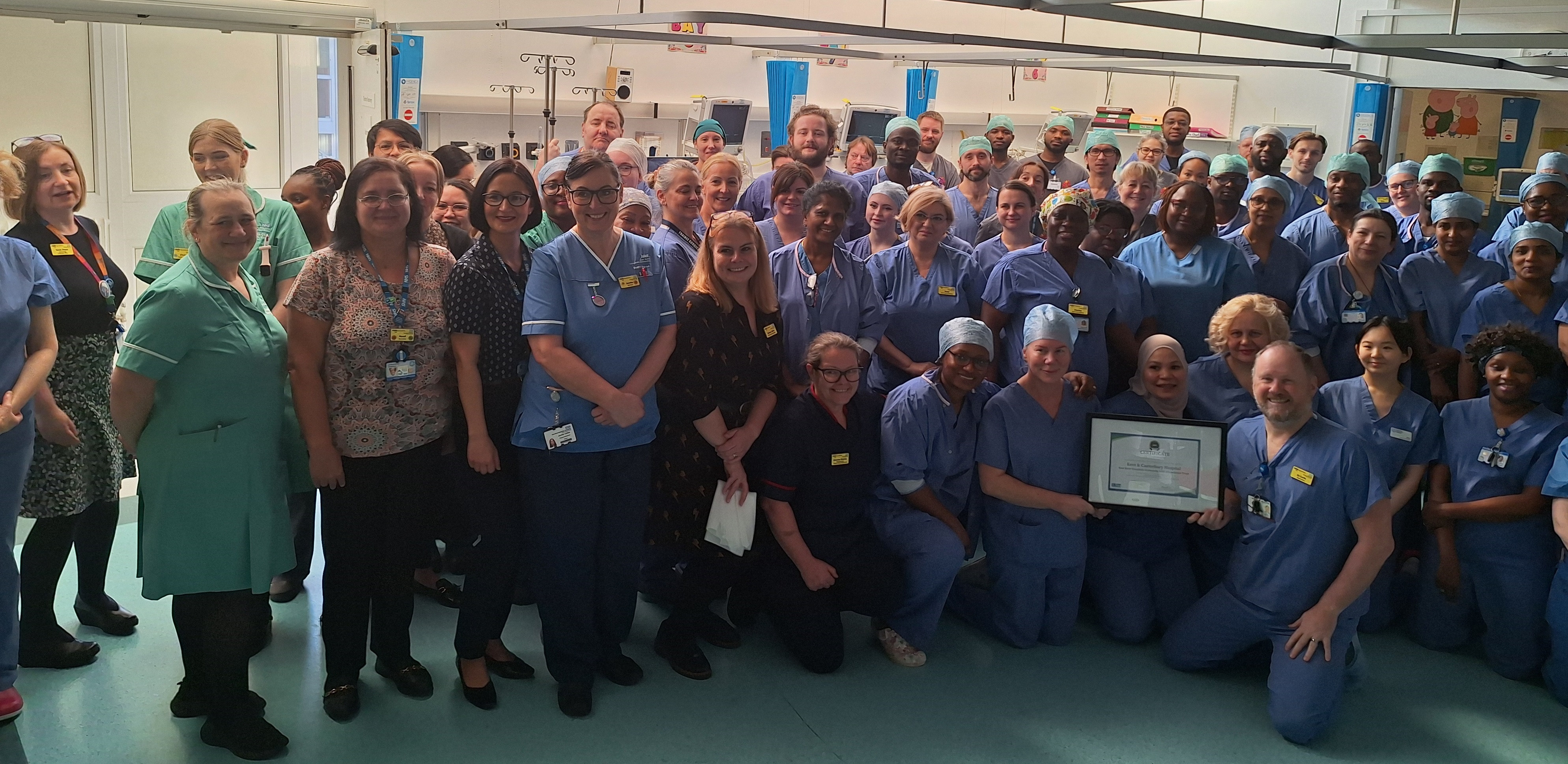 Ed Curtin, front, with the certificate and some of the K&C theatre team