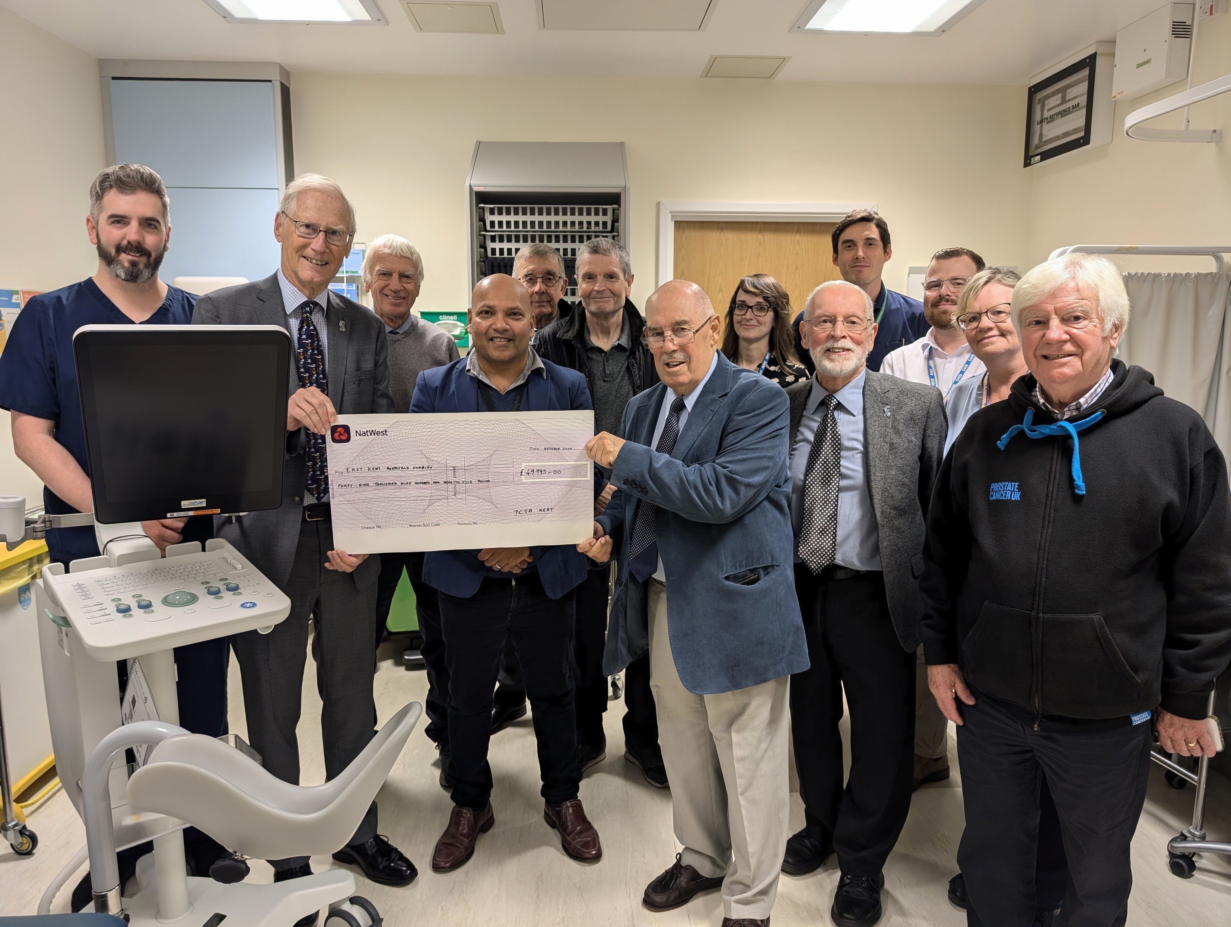 Members of PCSA Kent with some of the urology team and the machine they funded