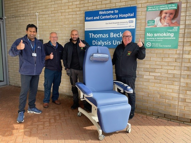 Some of the renal team with one of the new chairs outside the Thomas Becket dialysis unit