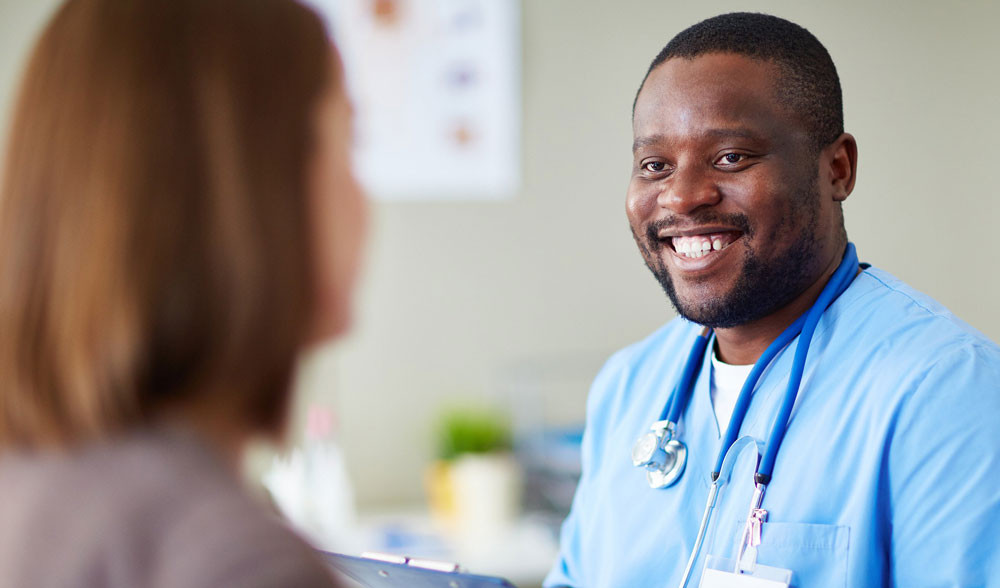 Male nurse talks to a patient